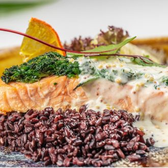 Salmon fillet stuffed with spinach on a bed of wild rice